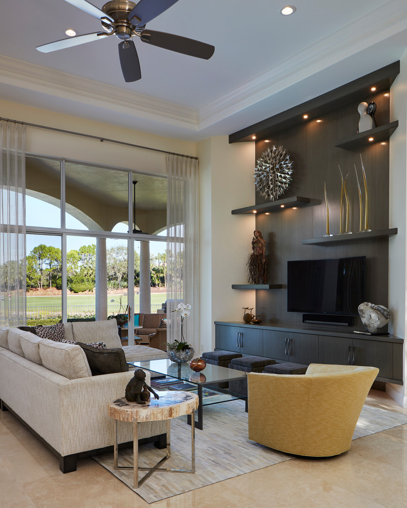 Photo of a large transitional open concept family room in Miami with brown walls, marble floors, a built-in media wall and beige floor.