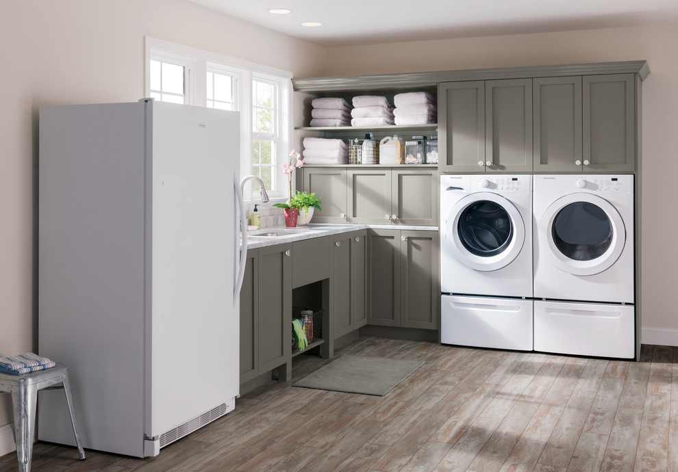 Design ideas for a transitional laundry room in Other with a side-by-side washer and dryer.
