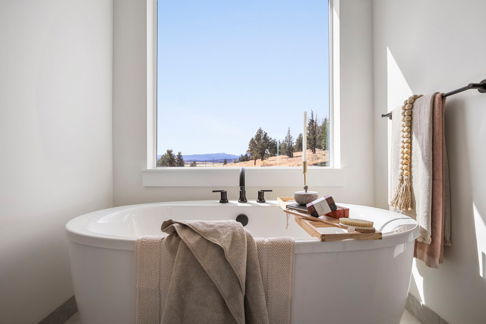 Example of a transitional master double-sink freestanding bathtub design