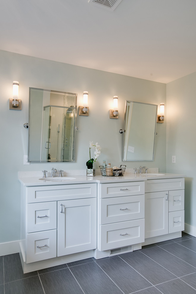 This is an example of a country master bathroom with shaker cabinets, white cabinets, a claw-foot tub, a corner shower, gray tile, porcelain tile, green walls, porcelain floors, an undermount sink and engineered quartz benchtops.