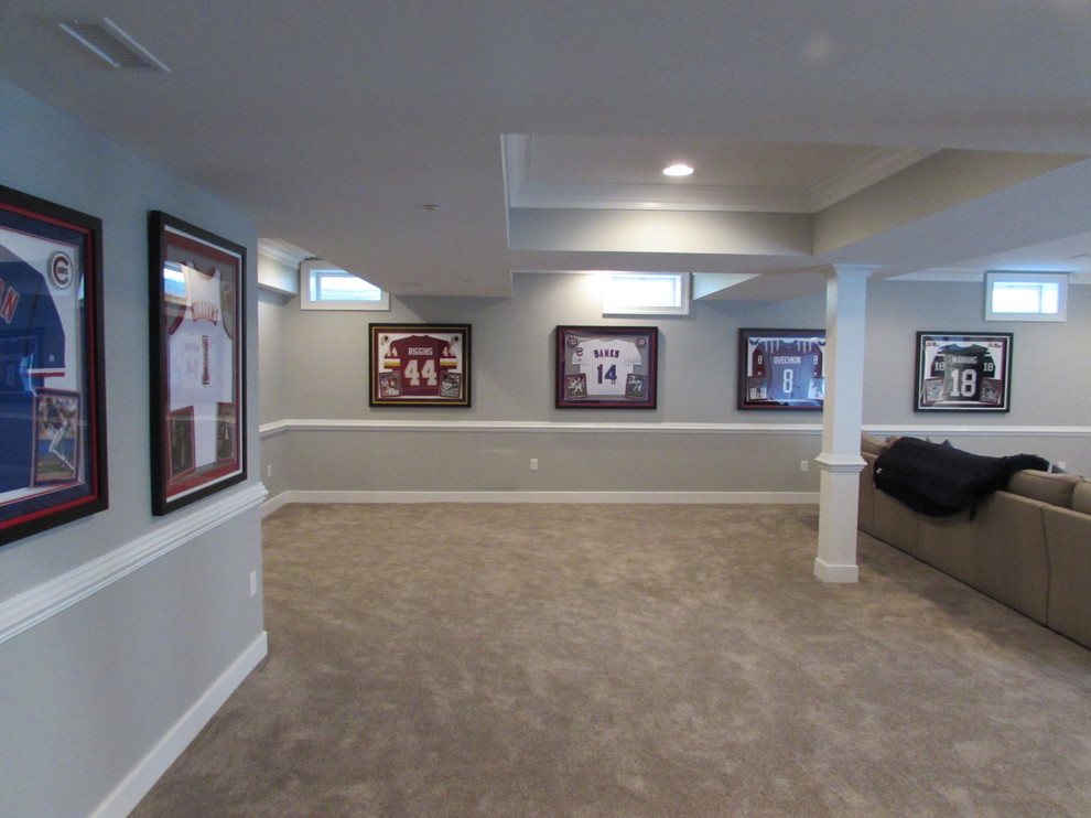 Large transitional walk-out basement in DC Metro with grey walls, carpet and no fireplace.