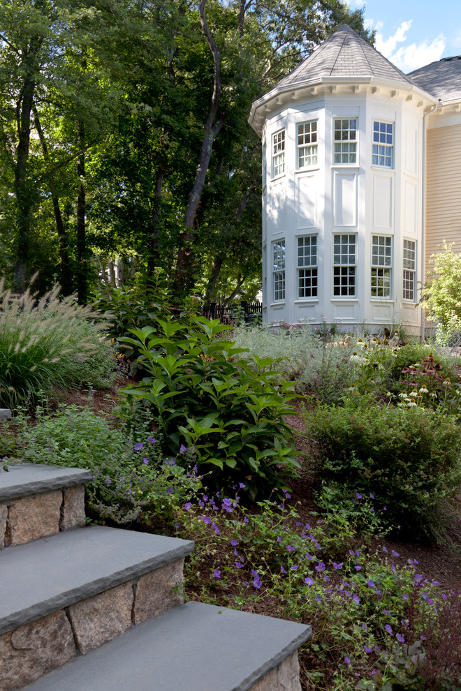 Inspiration for a traditional sloped garden in Boston.