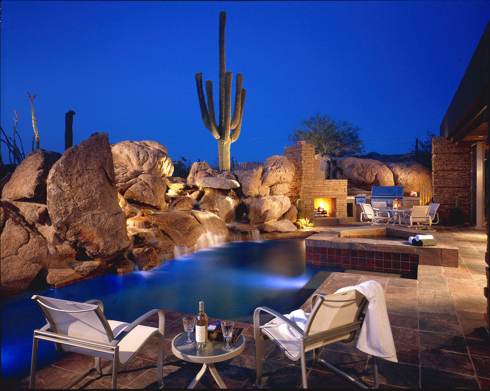 This is an example of a natural pool in Phoenix with a water feature.
