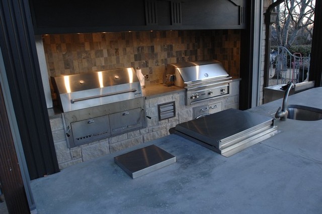 Outdoor Kitchen With Clean Concrete Countertops With Charcoal And