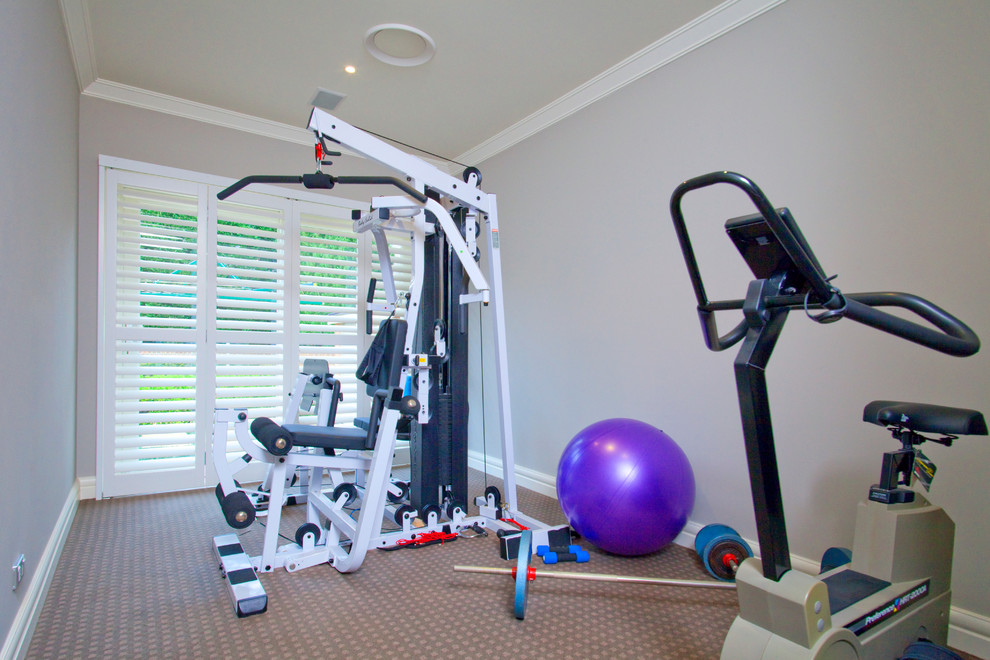 Design ideas for a mid-sized contemporary multipurpose gym in Sydney with beige walls and carpet.