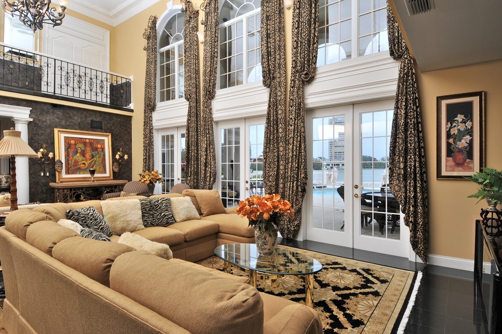 Inspiration for a large mediterranean living room in Tampa with beige walls and ceramic floors.