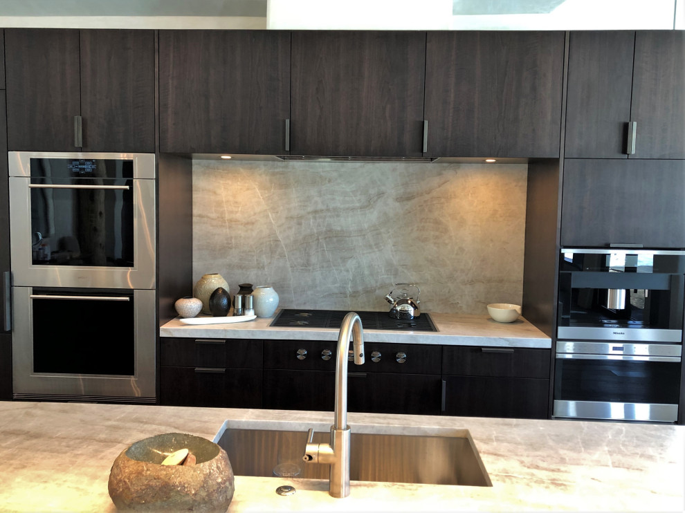 Inspiration for a large contemporary galley open plan kitchen in Other with an undermount sink, flat-panel cabinets, dark wood cabinets, coloured appliances, medium hardwood floors, with island, brown floor, multi-coloured benchtop and vaulted.
