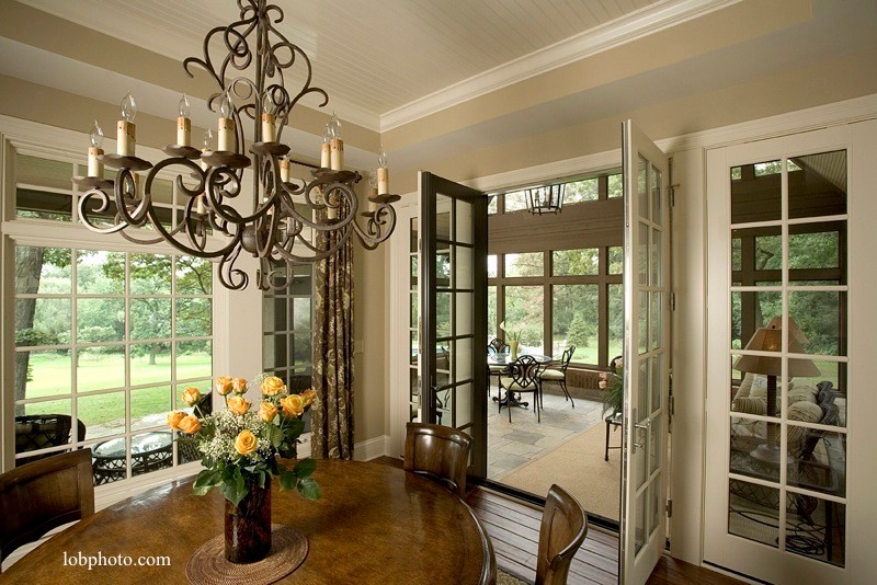 This is an example of a mid-sized traditional separate dining room in Chicago with beige walls and dark hardwood floors.