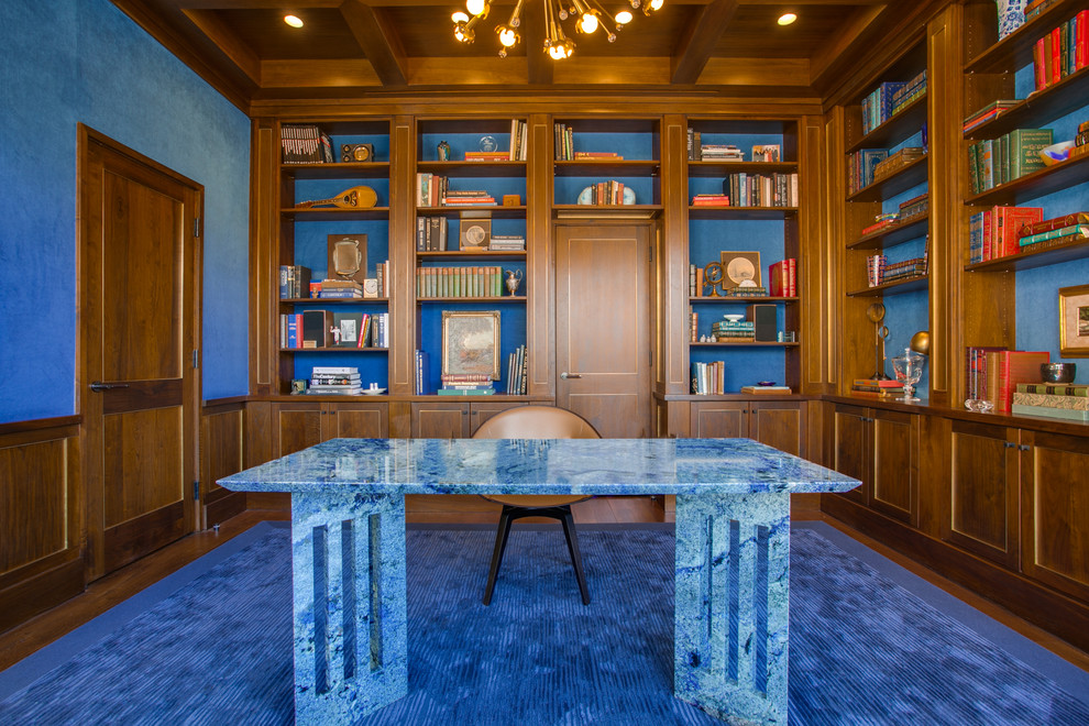 Large midcentury study room in Dallas with blue walls, medium hardwood floors, no fireplace and a freestanding desk.