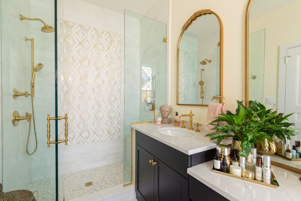 Small traditional master bathroom in New York with shaker cabinets, black cabinets, an alcove shower, a two-piece toilet, white tile, marble, yellow walls, marble floors, an undermount sink, engineered quartz benchtops, white floor, a hinged shower door, white benchtops, a niche, a single vanity and a built-in vanity.