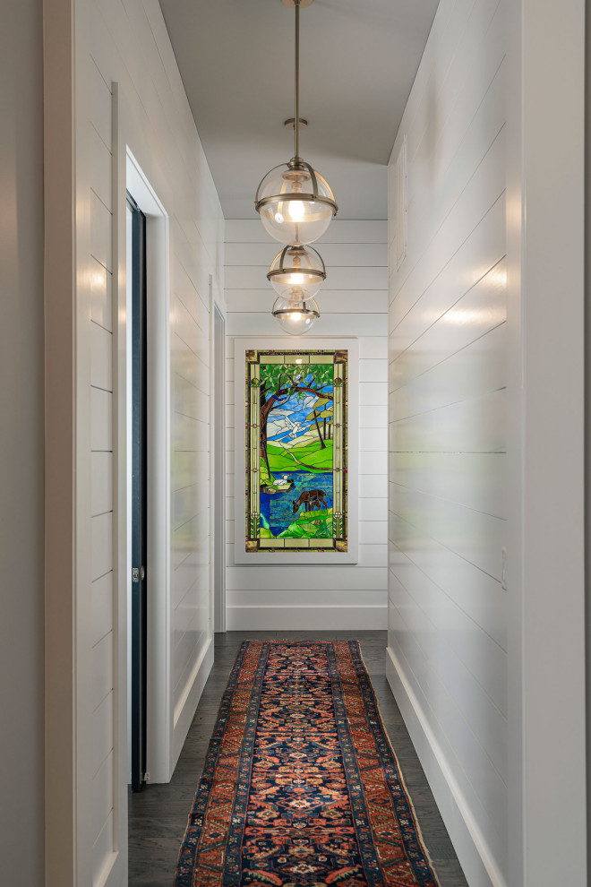 Hallway - mid-sized transitional dark wood floor and brown floor hallway idea with white walls