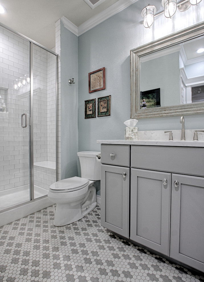 This is an example of a mid-sized transitional bathroom in Denver with grey walls and vinyl floors.