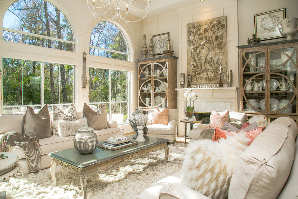 Inspiration for a shabby-chic style living room remodel in Houston with white walls and a standard fireplace