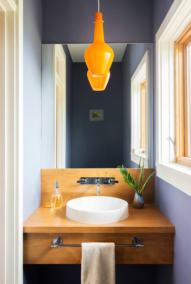 Contemporary powder room in Other with a vessel sink.