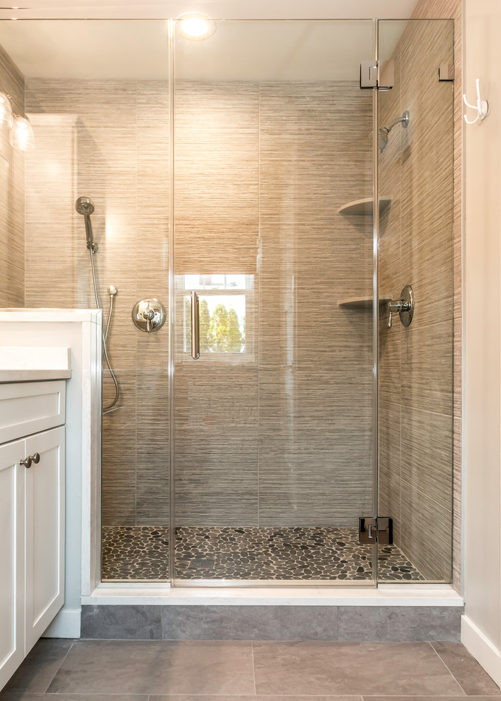 Design ideas for a mid-sized transitional 3/4 bathroom in New York with shaker cabinets, white cabinets, an alcove shower, gray tile, grey walls, ceramic floors, an undermount sink, engineered quartz benchtops, grey floor and a hinged shower door.
