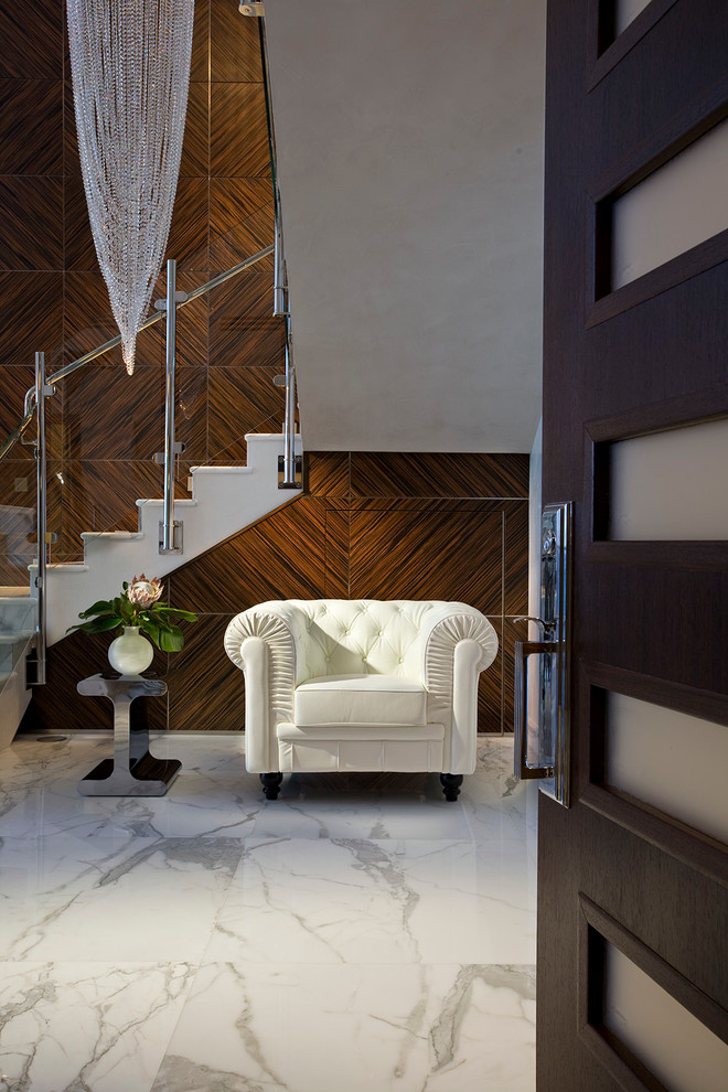 Inspiration for a large contemporary foyer in Miami with white walls, marble floors, a double front door and a dark wood front door.