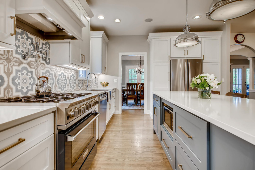 Example of a transitional kitchen design in Denver