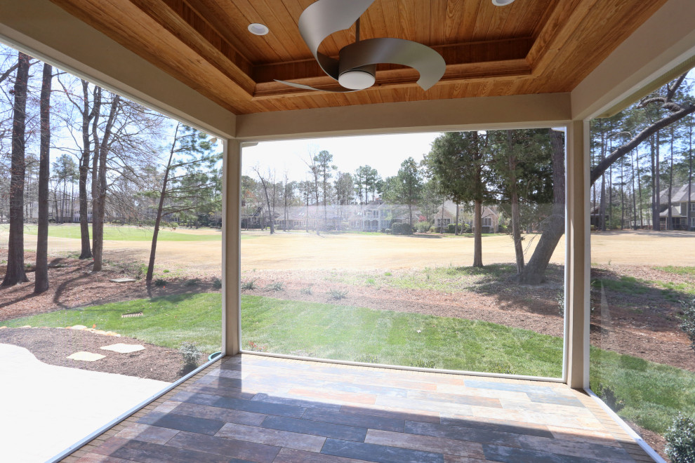 Example of a transitional home design design in Raleigh