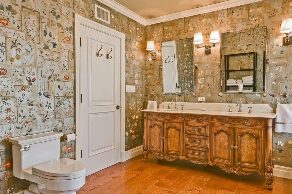 Inspiration for a traditional bathroom in Los Angeles with recessed-panel cabinets.