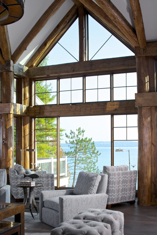 Living room - rustic dark wood floor and brown floor living room idea in Other
