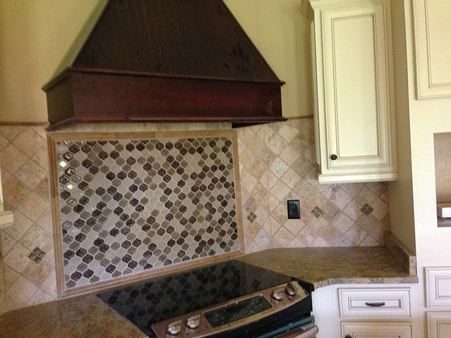Eat-in kitchen - modern eat-in kitchen idea in Atlanta with beige cabinets, granite countertops, multicolored backsplash, recessed-panel cabinets and stone tile backsplash