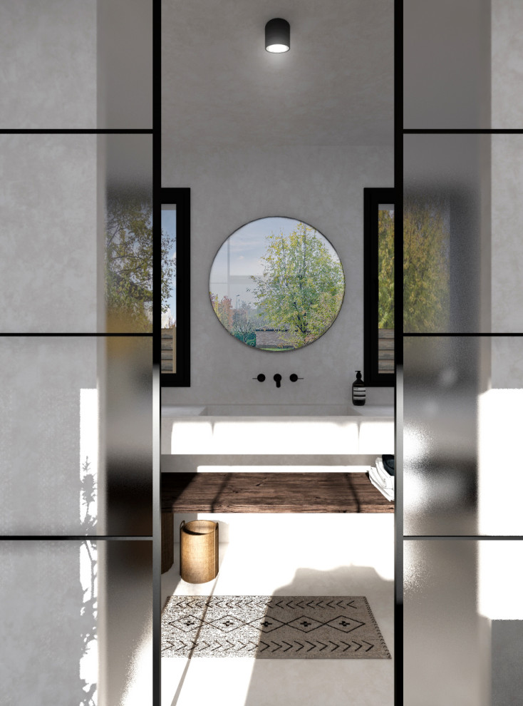This is an example of a medium sized mediterranean shower room bathroom in Bordeaux with open cabinets, white cabinets, a walk-in shower, a wall mounted toilet, white tiles, white walls, concrete flooring, a console sink, concrete worktops, white floors, an open shower, white worktops, a single sink and a floating vanity unit.