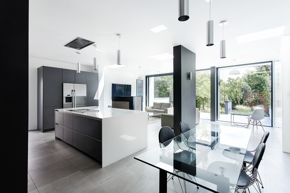 Inspiration for a medium sized contemporary open plan dining room in Hampshire with white walls and porcelain flooring.