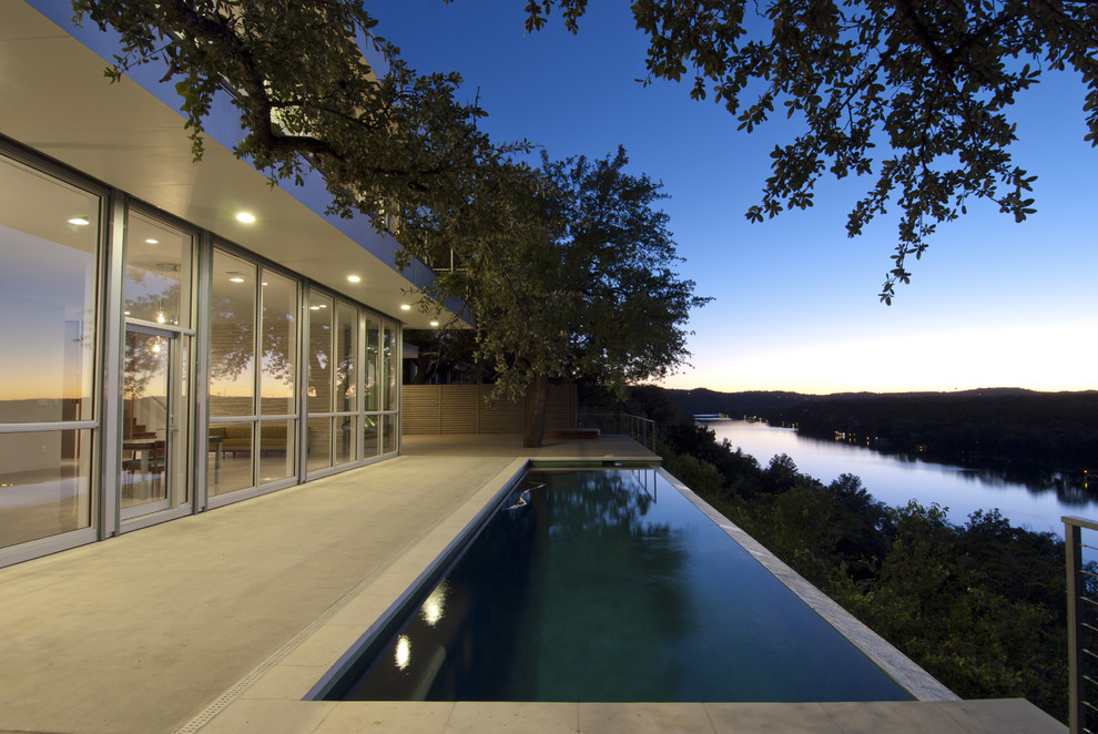 Photo of a modern one-storey glass exterior in Austin.
