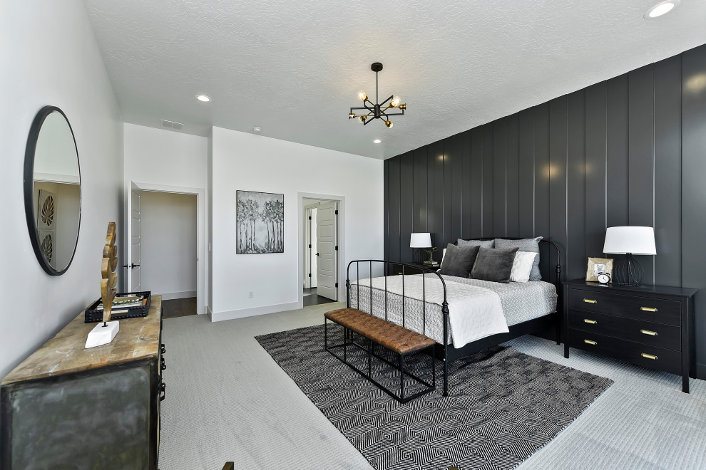 Photo of a mid-sized transitional master bedroom in Boise with black walls, carpet, no fireplace, panelled walls and grey floor.