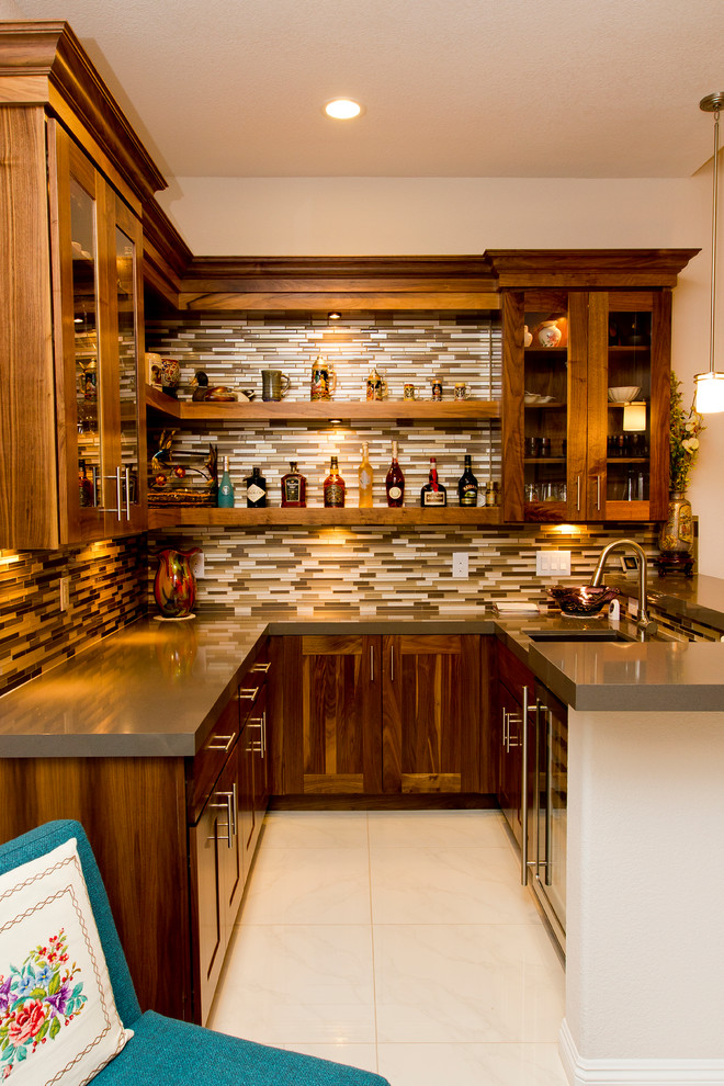 This is an example of a mid-sized contemporary home bar in Las Vegas.