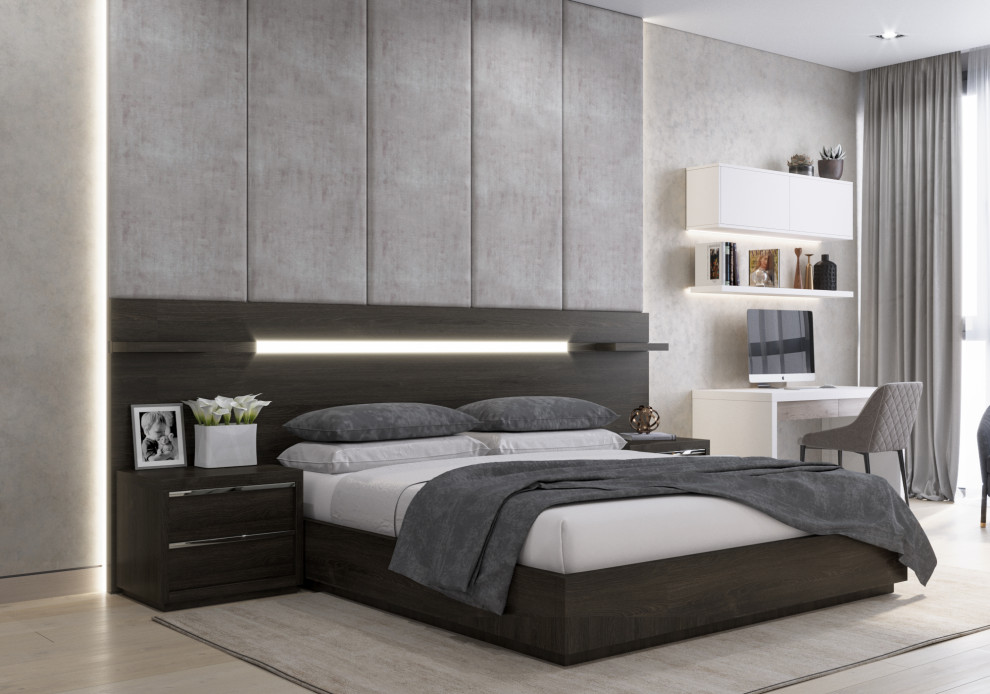 Mid-sized contemporary master bedroom in Other with beige floor, beige walls and laminate floors.