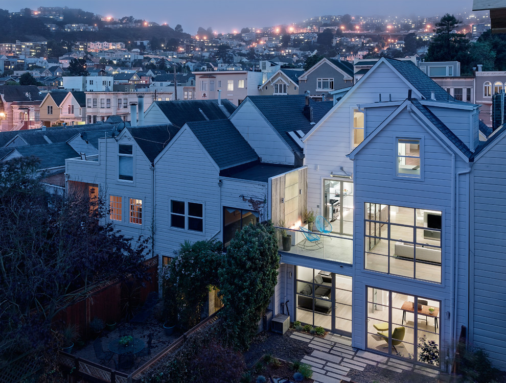 Inspiration for a transitional two-storey white exterior in San Francisco with wood siding.