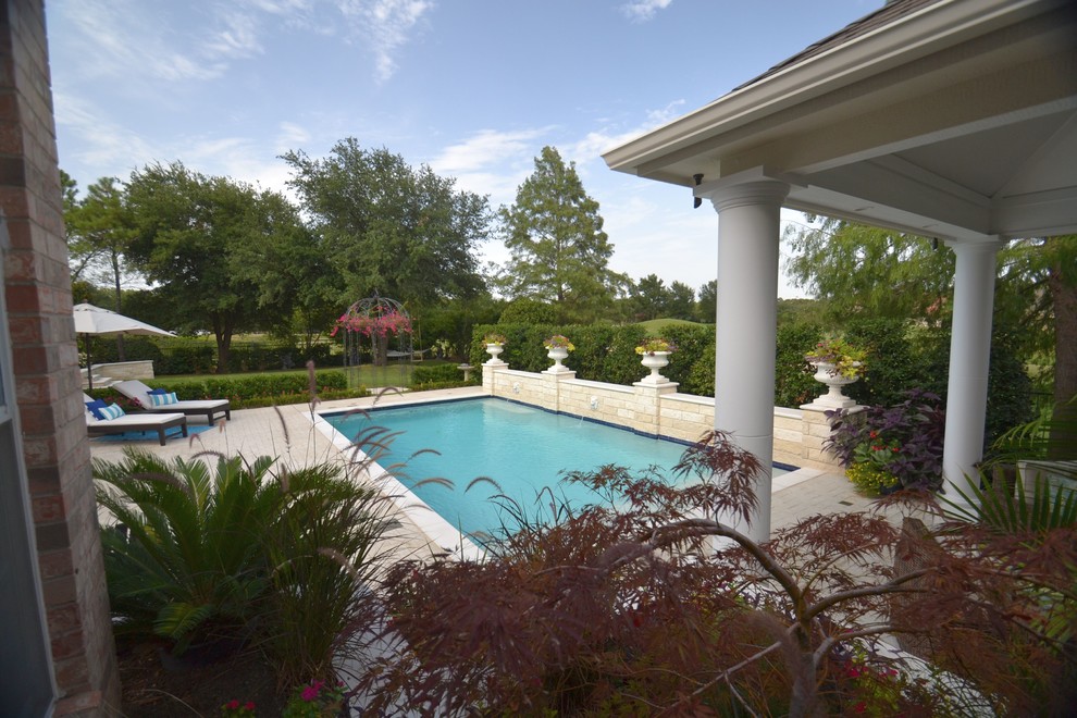 Mid-sized backyard rectangular pool photo in Dallas