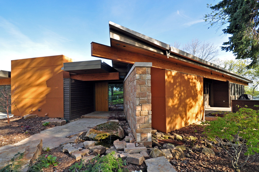 Photo of a contemporary one-storey orange exterior in Other.