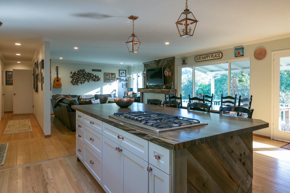 Open concept kitchen - large transitional l-shaped light wood floor open concept kitchen idea in San Francisco with a farmhouse sink, shaker cabinets, gray cabinets, marble countertops, multicolored backsplash, mosaic tile backsplash, paneled appliances and an island
