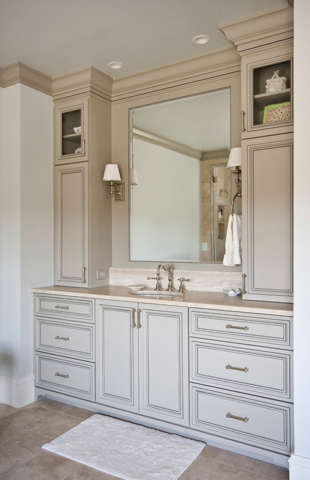 Design ideas for a large traditional master bathroom in Charleston with recessed-panel cabinets, beige cabinets, an alcove shower, beige walls, ceramic floors, an undermount sink, beige floor and a hinged shower door.