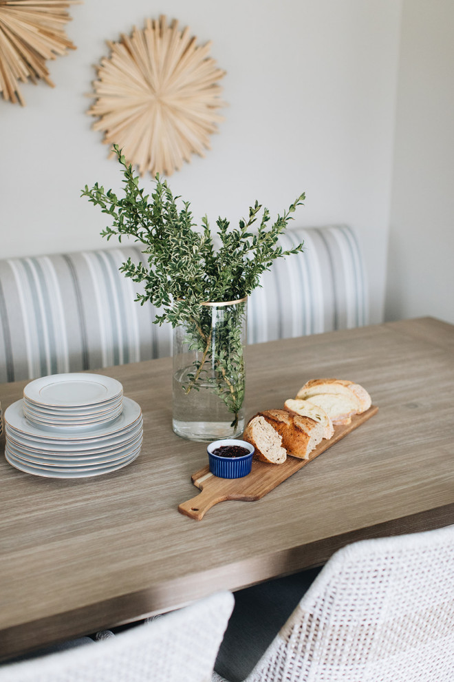 Eat-in kitchen - mid-sized transitional dark wood floor and brown floor eat-in kitchen idea in Chicago with a farmhouse sink, beaded inset cabinets, white cabinets, quartz countertops, paneled appliances, an island and white countertops