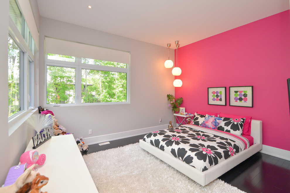 Inspiration for a contemporary kids' bedroom for kids 4-10 years old and girls in Ottawa with dark hardwood floors and multi-coloured walls.