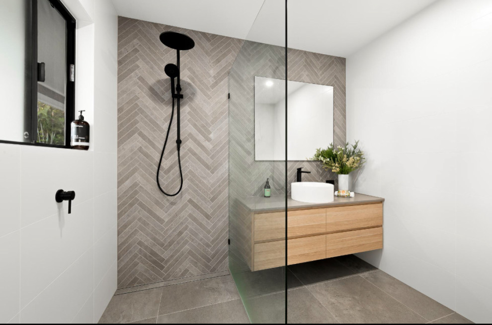 Design ideas for a large modern bathroom in Sunshine Coast with flat-panel cabinets, light wood cabinets, white tiles, white walls, engineered stone worktops, beige floors, an open shower, beige worktops, a single sink and a floating vanity unit.