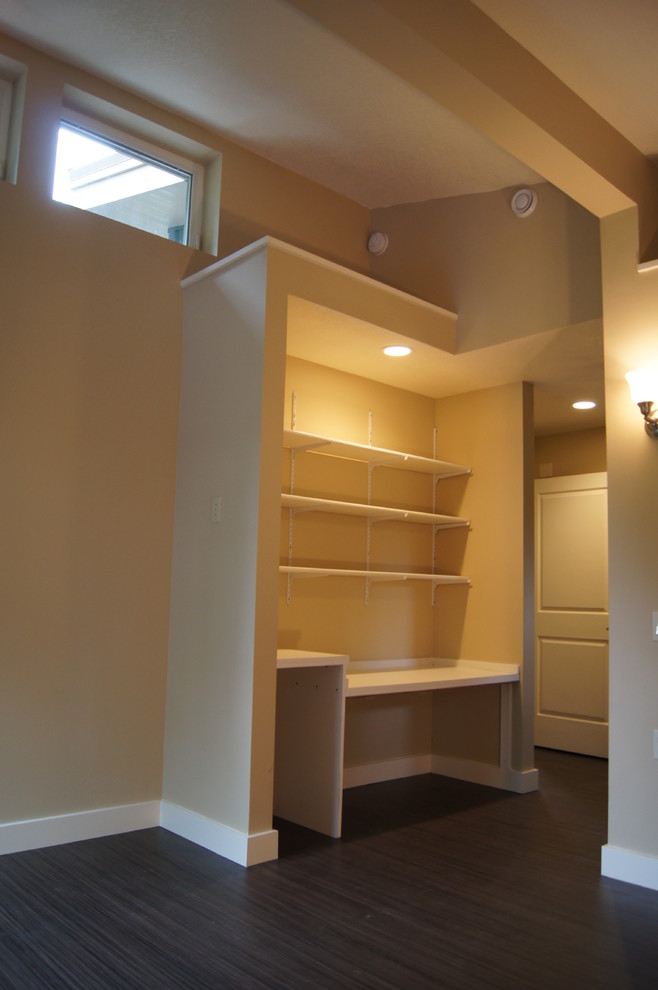 Inspiration for a small modern home office in Portland with beige walls and linoleum floors.