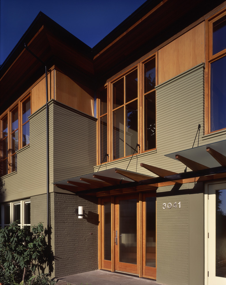 Photo of a contemporary entryway in Seattle with a single front door and a glass front door.