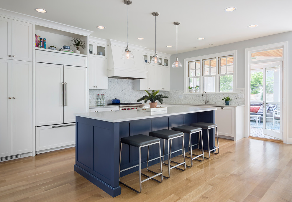 Mid-sized transitional l-shaped kitchen in Minneapolis with shaker cabinets, white cabinets, quartz benchtops, grey splashback, marble splashback, panelled appliances, with island, light hardwood floors, beige floor and grey benchtop.