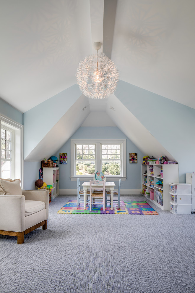 Photo of a mid-sized transitional gender-neutral kids' playroom for kids 4-10 years old in New York with blue walls, carpet and grey floor.