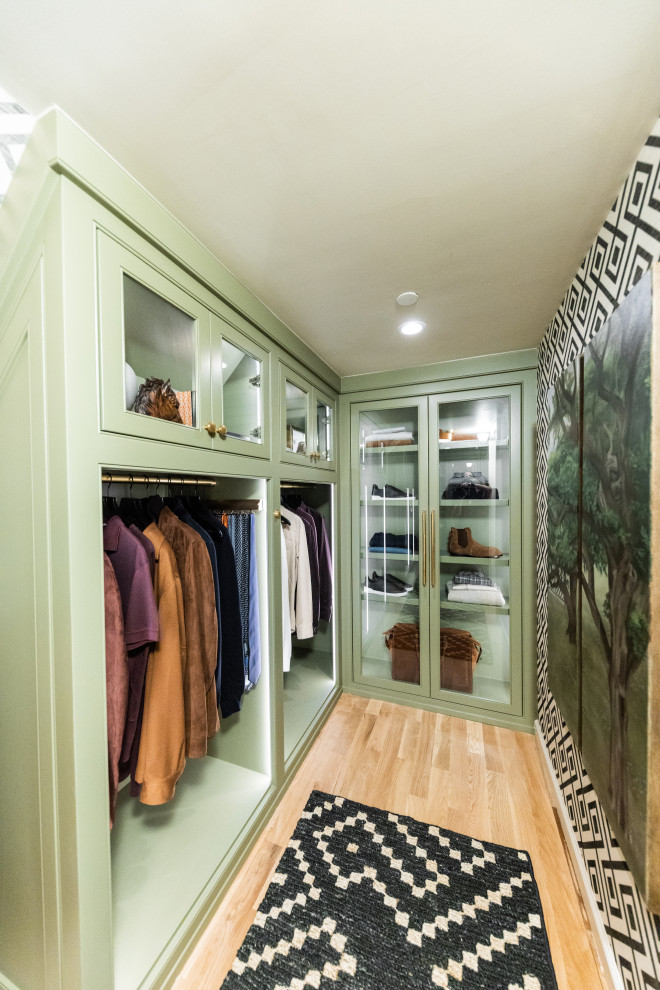 Photo of a small traditional walk-in wardrobe for men in Dallas with beaded cabinets, green cabinets, light hardwood flooring and beige floors.