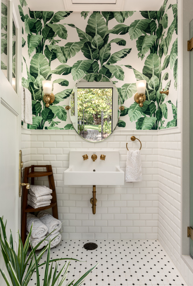 Inspiration for a medium sized traditional bathroom in Nashville with an alcove shower, white tiles, metro tiles, porcelain flooring, a wall-mounted sink, white floors, a hinged door, an enclosed toilet, a single sink, a floating vanity unit and wallpapered walls.