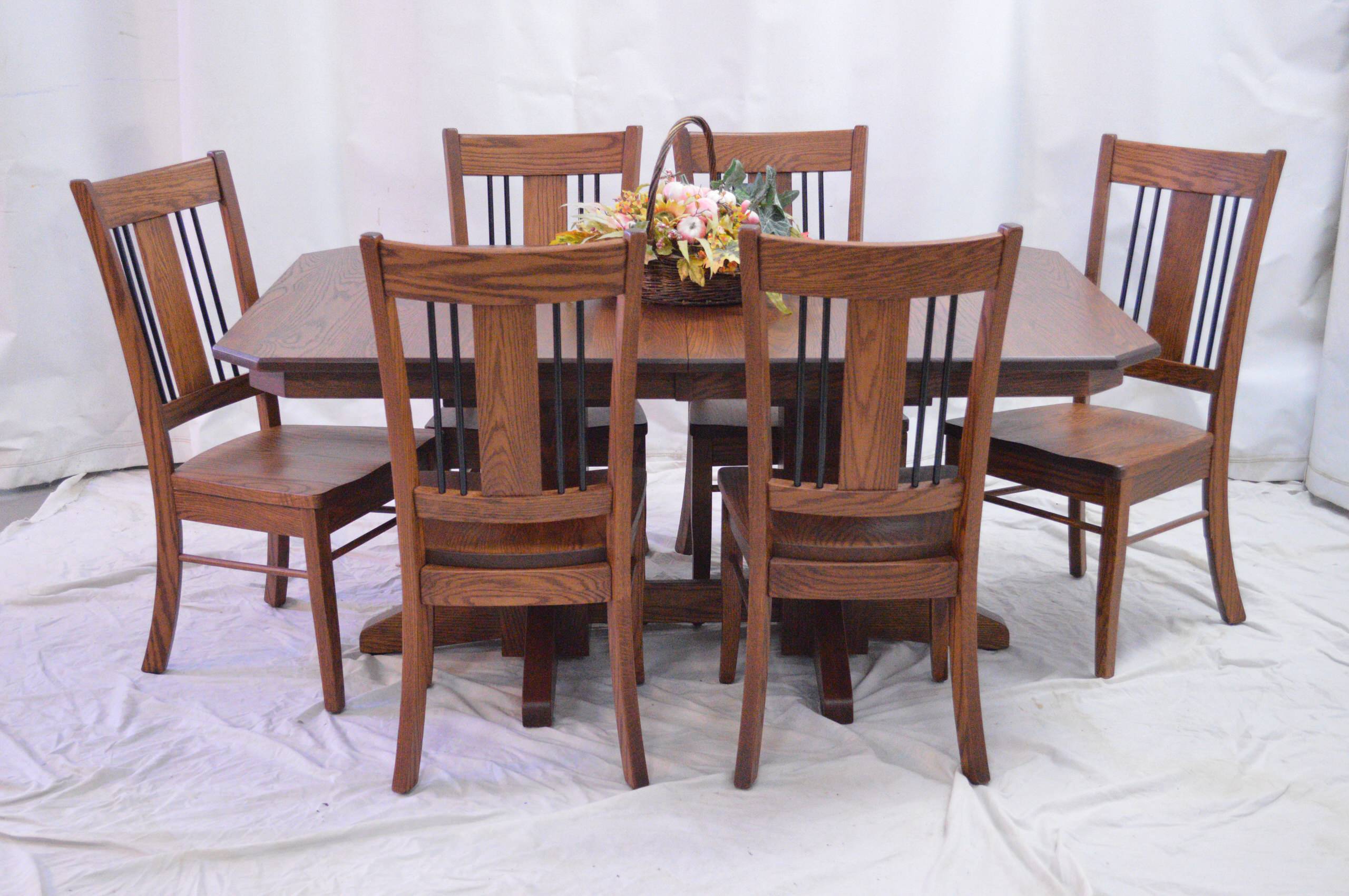 Clip corner oak 4 leaf table with Oxford/wrought iron chairs