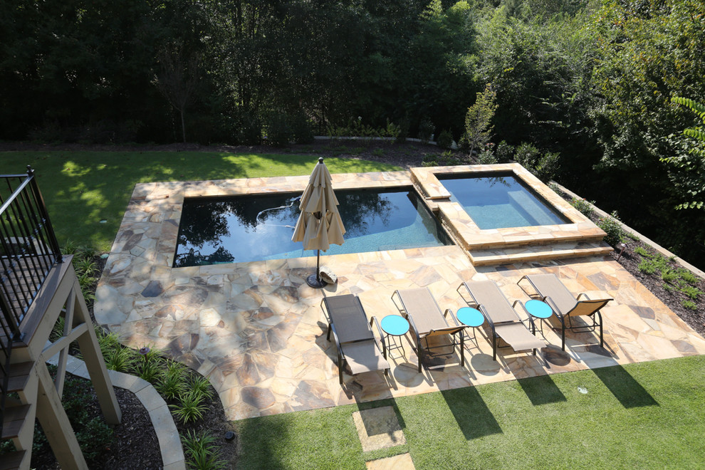 Mid-sized arts and crafts backyard rectangular lap pool in Atlanta with a hot tub and natural stone pavers.