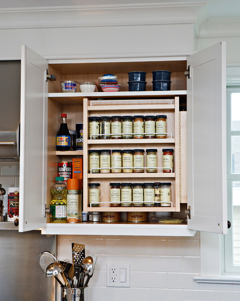 Beach style eat-in kitchen photo with recessed-panel cabinets, white cabinets, subway tile backsplash and white backsplash