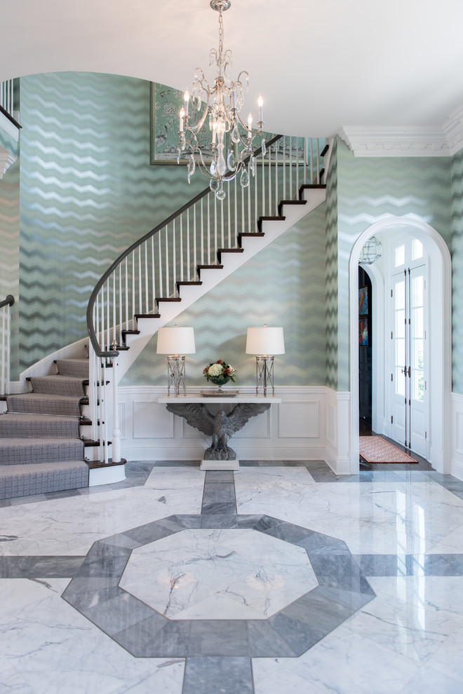 This is an example of a traditional foyer in Louisville with green walls and multi-coloured floor.