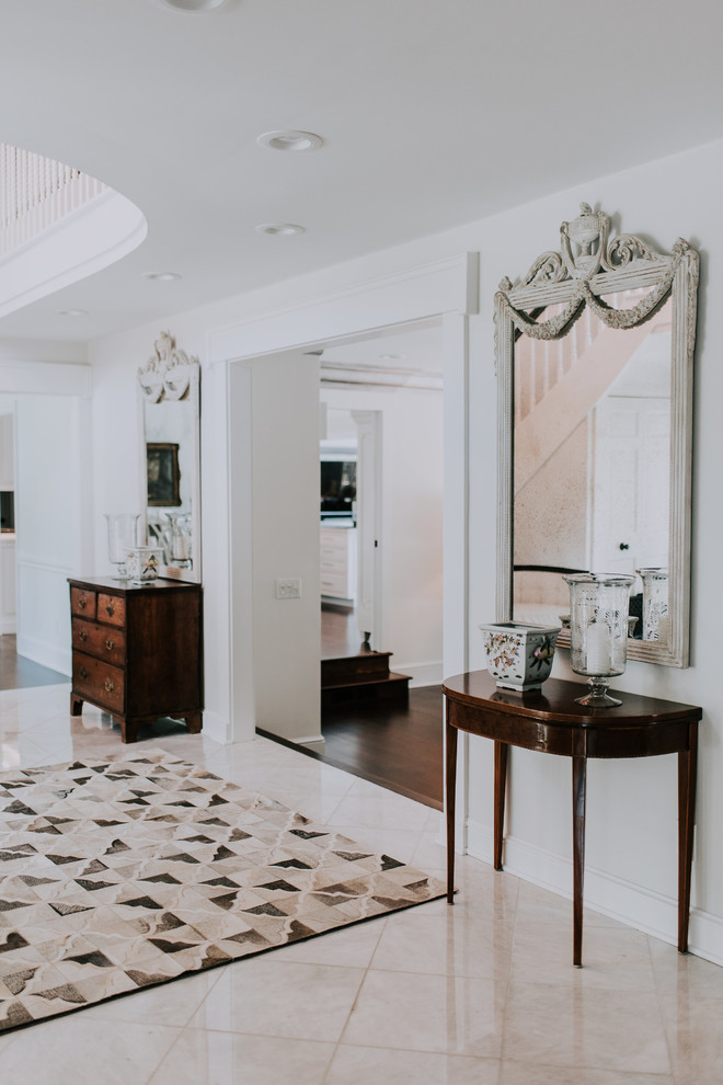Entryway - transitional dark wood floor and brown floor entryway idea in Cleveland with blue walls